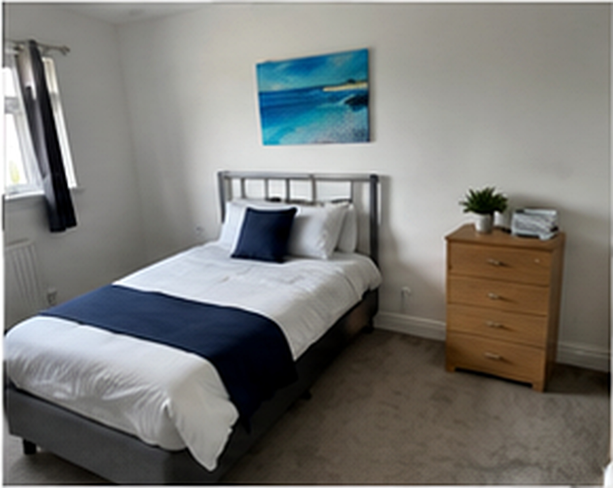 Bedroom with wall art at Salford Family House